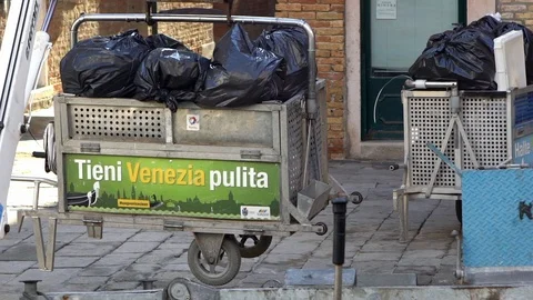 Slow Motion Close up of boat collecting rubbish by crane on the canal. Italy-Dan Stock Footage 100245505