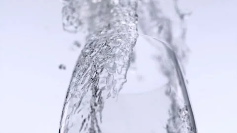 Slow motion close up bottle of water being poured into glass Sparkling water Stock Footage 265844853