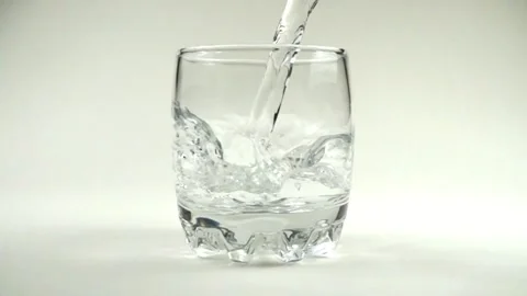 Slow motion close up bottle of water being poured into glass Sparkling water Stock Footage 265846832