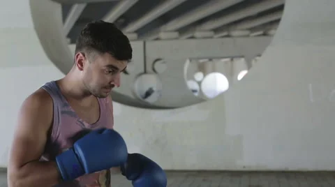 Slow motion. Close up. Boxer is preparing to the fight outdoors. Stock Footage 68756960