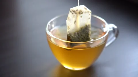 Slow Motion Close-up Brew Green Tea in Transparent Mug 스톡 동영상 151311779