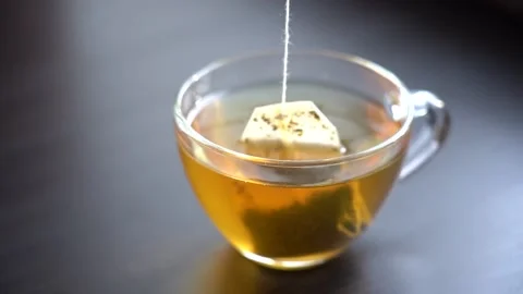 Slow Motion Close-up Brew Green Tea in Transparent Mug Stock Footage 166997401