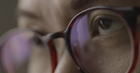 Slow motion close-up brown eye with glasses is opening and looking. Stock-Footage 140256799