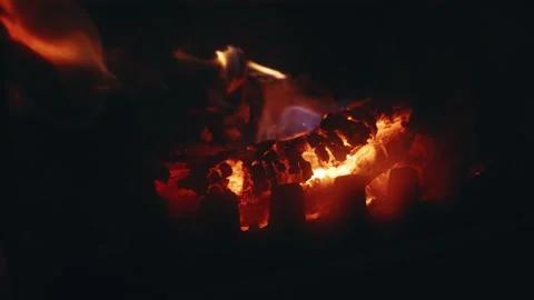Slow Motion Close-Up of Burning Charcoal with Flaking Char Stock Footage 342584778