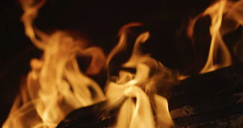 Slow motion close-up of burning fire in a fireplace. Shot on Red Stock Footage 138127515