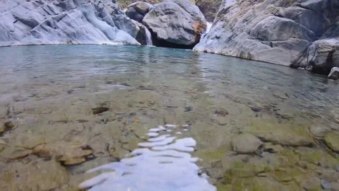 Slow motion close up to calm transparent clear river water with ripple on surfac Stock Footage 265491628