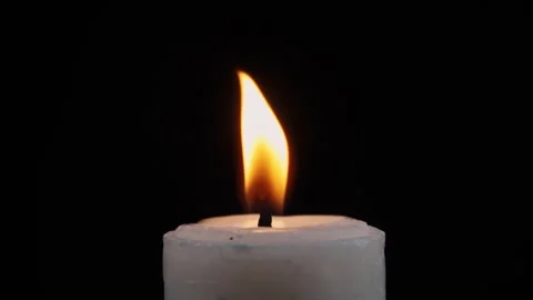 Slow motion close up of candles lit isolated black background Stock Footage 279125884