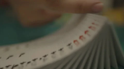 Slow motion close-up of cards facing down, hand tracking Vidéo 334037068