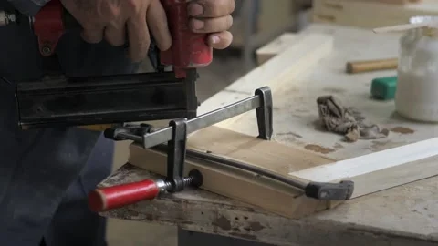 Slow motion. Close-up of a carpenter working with a pneumatic pistol. A Stock Footage 201048930