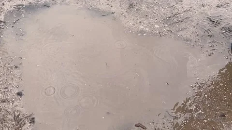 Slow motion close-up of a child jumping into a puddle Stock-Footage 189987301