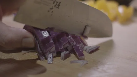 Slow Motion Close Up of Chopping Onions Stock Footage 128995648
