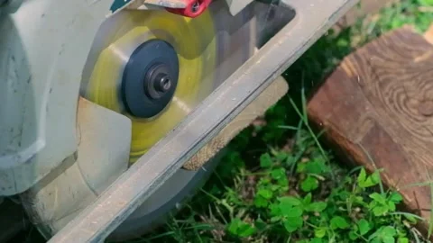 Slow Motion Close-Up of Circular Saw Cutting Wood Stock Footage 320839611
