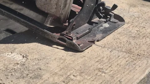 Slow Motion Close-up of Circular Saw Cutting Wood with Sawdust Flying Stock-Footage 334335020