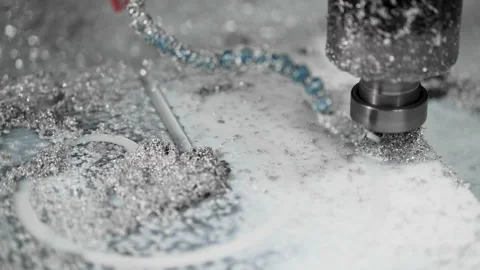Slow-motion close-up of CNC operation. Alimium part covered with metal shavings Stock Footage 167654249