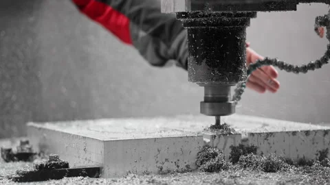 Slow-motion close-up of CNC. Operator adjusts direction of cooling system Stock Footage 167549375
