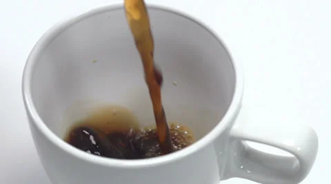 Slow motion close up on coffee pouring into cup Видео 34425195