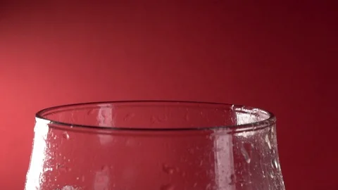Slow Motion Close-Up Cola Pour Into Glass On A Red Background Stock-Footage 122694106
