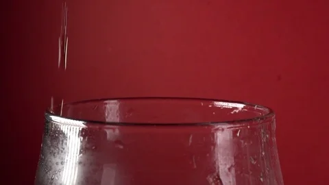 Slow Motion Close-Up Cola Pour Into Glass On A Red Background Stock-Footage 122694608