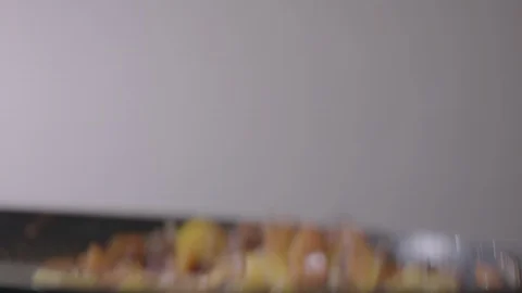 Slow Motion Close Up of Cooking Vegetables in Pan Stock Footage 128995590