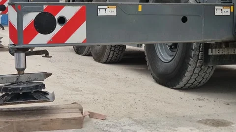 Slow Motion Close-up of Crane Hydraulic Outrigger Retracting Stock Footage 341104550