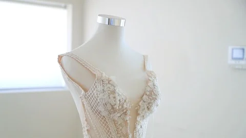 Slow motion close up of cream wedding dress embroidery Stock Footage 88707853