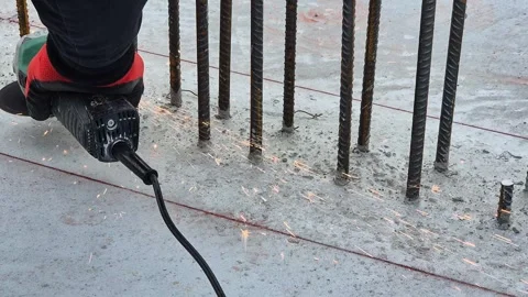 Slow motion close up of cutting rebar with angle grinder throwing sparks Stock Footage 335068751