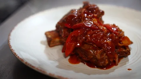 Slow motion close up detailed view on arranging delicious restaurant meal pork Stock Footage 106979499