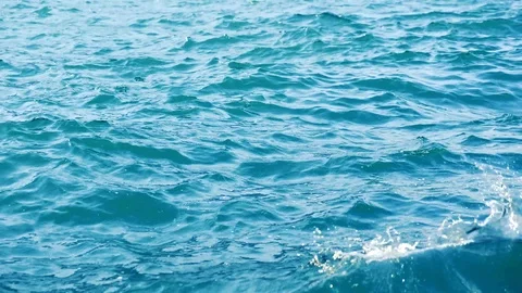 Slow motion close up of disturbed blue ocean water surface. Nature ocean slow Stock Footage 95833923