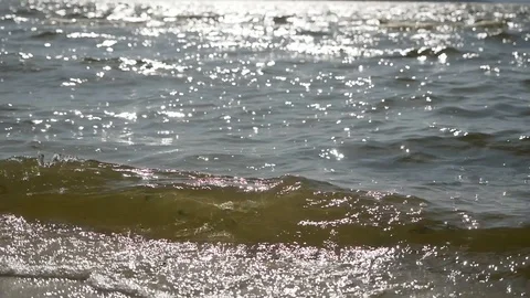 Slow motion close up of disturbed blue ocean water surface. Nice looping Stock Footage 128418264