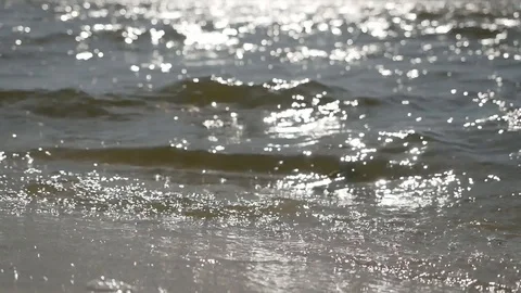 Slow motion close up of disturbed blue ocean water surface. Nice looping Stock Footage 128419517
