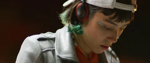 Slow motion close up of DJ woman's face preparing for night party, Japan Stock Footage 128973699