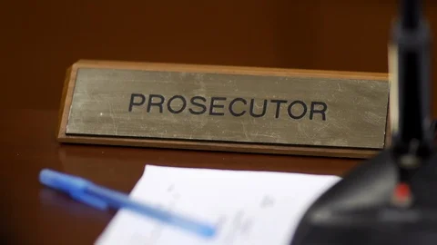  Slow motion close-up dolly shot of prosecutor nameplate  Stock Footage 85575899