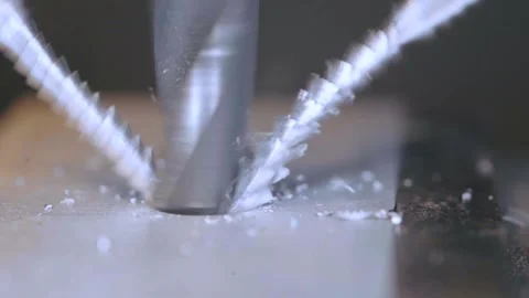 Slow motion close up of drill bit drilling into aluminum. Stock Footage 143744089