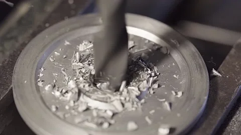Slow motion close up of drill bit drilling into aluminum. Stock Footage 143744093