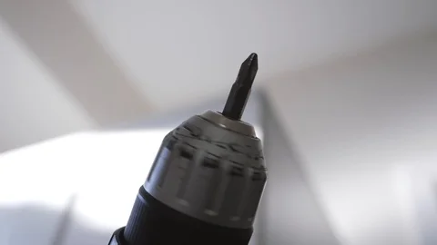 Slow motion close up of a drill spinning in the air while building ikea Video stock 112972669