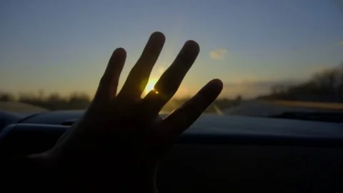 SLOW MOTION CLOSE UP: Driving in red convertible, arm outside of car playing Stockbeeldmateriaal 73107163