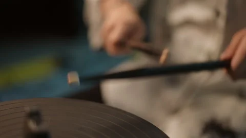 Slow motion. Close-up. Drumsticks knocking against each other. An unrecognizable Stock Footage 265918921