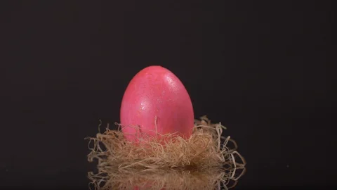 Slow Motion of Close up of Easter Eggs Rotating on Black Background. Easter Video stock 129209686