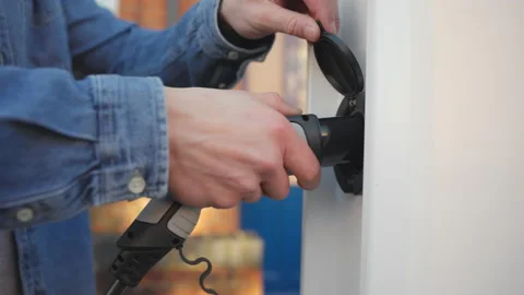 Slow motion close up electric car charging Stock Footage 169449689