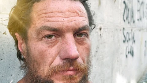 Slow motion close-up face of real homeless man Stock Footage 113617053