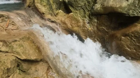 Slow motion close up of a fast flowing mountain waterfall Stock Footage 321325952