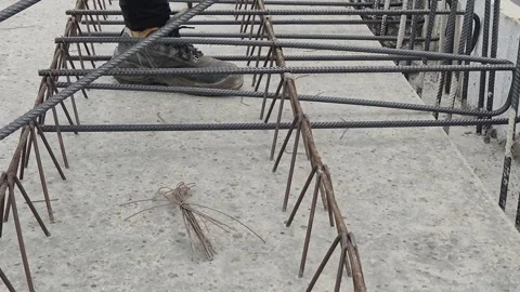 Slow Motion Close-up of Fixing Rebar Stirrup with Tie Wire Stock Footage 333987035
