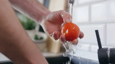 Slow Motion Close Up Footage Of A Man Washing Tomatoes With Tap Water Stock Footage 151327271