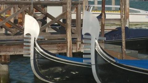 Slow motion close up of fronts of Gondolas Close at Saint Mark's Square, Veni Stock Footage 83399477