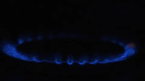 Slow motion Close up of gas ring hob cooker isolated black background  Stock Footage 86537796
