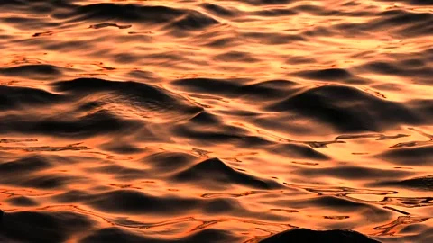 Slow motion close-up of the golden sun reflection on the water surface. Sea Stock Footage 250155847