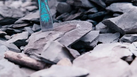 Slow Motion Close-up: Hammer Striking Chisel Placed on Granite Stock Footage 337140940