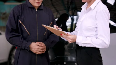 Slow motion, close-up hand car mechanic in suit working in garage, mechanic.. Stock Footage 240571358