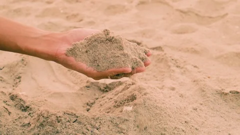 Slow Motion Close up hand Holding Sand. Sunlight in the morning 動画素材 108225744