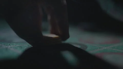 Slow motion close-up hand placing chips on 13 Stock Footage 335700048
